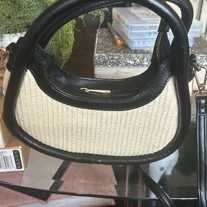 I have a crossbody purse that’s cream and black that has never been used